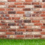 brick foundation on grass