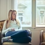 woman sitting by a window