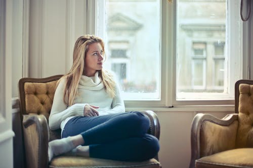 woman sitting by a window